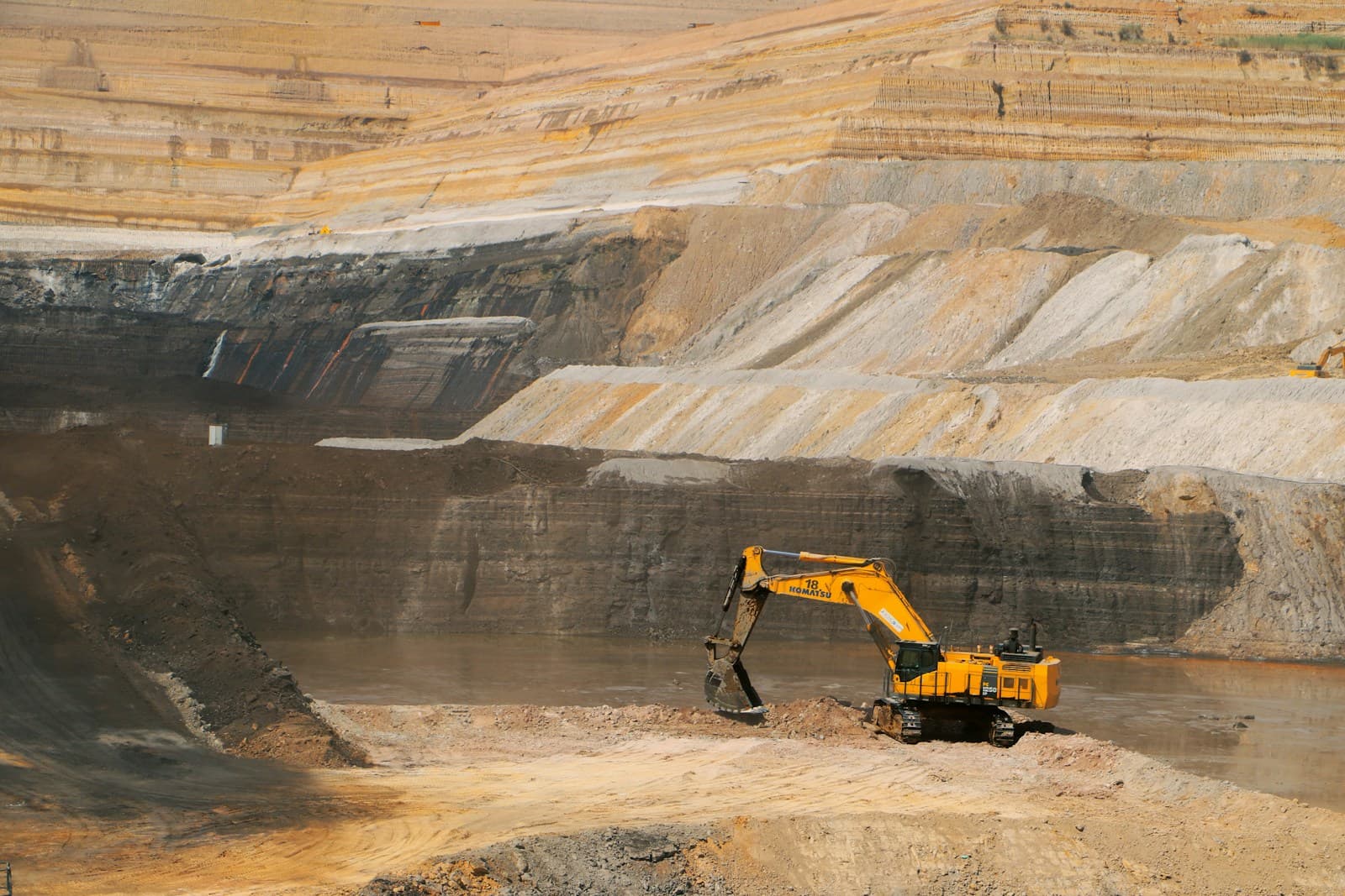 Excavator working an open-pit mining site